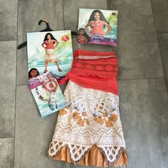 three pieces of clothing laid out on the floor next to each other, one with an image of a woman