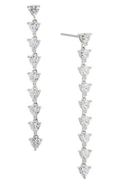 A line of faceted cubic zirconia illuminates these stunning drop earrings that are hand-polished to an exquisite shine. 2" drop; 1/4" width Post back Rhodium plate or 18k-gold plate/cubic zirconia Imported Classic Cubic Zirconia Chandelier Earrings For Formal Occasions, Classic Formal Chandelier Earrings In Cubic Zirconia, Formal Chandelier Earrings With Brilliant Cut Cubic Zirconia, Formal Fine Jewelry Linear Cubic Zirconia Earrings, Glamorous Long Drop Sparkling Jewelry, Formal Sparkling Cubic Zirconia Chandelier Earrings, Dazzling Long Drop Evening Jewelry, Teardrop Chandelier Earrings In Cubic Zirconia With Brilliant Cut, Brilliant Cut Teardrop Chandelier Earrings With Cubic Zirconia