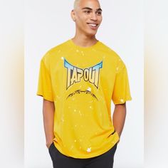 Vintage Tapout Mma Gradient Splattered Athletic Yellow Shirt Tee Relaxed Fit Paint Splatter T-shirt With Crew Neck, Acid Wash Casual Tops With Logo Print, Casual Acid Wash Tops With Logo Print, Yellow Graffiti Print Crew Neck Top, Yellow Crew Neck Top With Graffiti Print, Distressed Graphic Tee For Streetwear, Distressed Relaxed Fit Shirt For Streetwear, Relaxed Fit Distressed Shirt For Streetwear, Casual Paint Splatter Tops For Summer