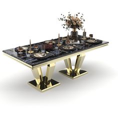 a black and gold dining table with plates, silverware and flowers on the top