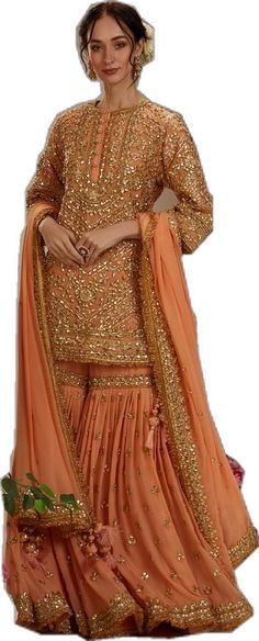 Elegant Peach Sharara With Traditional Drape, Elegant Peach Sharara For Diwali, Peach Sharara With Dabka Work For Weddings, Orange Georgette Sharara With Dabka Work, Designer Peach Sharara With Traditional Drape, Traditional Designer Wear Peach Sharara, Peach Sharara With Zari Work For Festivals, Festive Peach Sharara With Traditional Drape, Designer Festive Peach Sharara