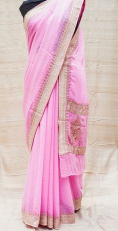 Category: Georgette Saree An exclusive Banarasi saree from Khinkhwab. Add a dash of your favorite color to your ethnic look with this beautiful Banarasi saree. Fabric - Pure Georgette Silk Georgette is a lightweight, crinkled and sheer fabric, displaying an overall bouncy look. A strong absorbent, Georgette is easy to dye and has a dull-rough texture. Georgette is made from twisting yarns of silk. Color -Pink Weave - Kadwa Craftsmanship - Ari zardozi work material used: Dabka(Saadi),sequins, res Eid Puja Pre-draped Saree With Embroidered Border, Transitional Festive Pre-draped Saree With Embroidered Border, Eid Art Silk Pre-draped Saree With Pallu, Festive Dola Silk Pre-draped Saree With Embroidered Border, Diwali Katan Silk Pre-draped Saree In Traditional Drape, Eid Puja Pre-draped Saree With Resham Embroidery, Pink Raw Silk Pre-draped Saree With Resham Embroidery, Semi-stitched Bollywood Dola Silk Saree, Dola Silk Pre-draped Saree With Embroidered Border For Puja