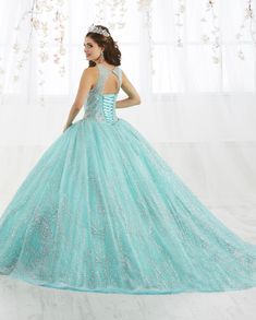 Be the center of attention in this long beaded illusion dress with A-line skirt by House of Wu 26915 during your Quinceanera, Sweet 16 party, or for any formal event. Be the belle of the ball in this metallic beaded ball gown! The sleeveless sheer bodice features a front and back keyhole detail. The floor length A-line skirt showcases cascades of sparkling scrolls for a touch of drama. This look is finished with a corset back and a gorgeous train. House of Wu Quinceanera Collection Spring 2019 S Blue Quinceanera Dress For Prom Season, Blue Quinceanera Dress For Gala During Prom Season, Fitted Quinceanera Dress For Prom Season Homecoming, Fitted Quinceanera Dress For Homecoming And Prom Season, Elegant Quinceanera Dress With Fitted Bodice For Homecoming, Blue Tulle Quinceanera Dress For Gala, Blue Sequin Quinceanera Gown, Blue Sequin Gown For Quinceanera, Blue Embellished Fitted Quinceanera Dress