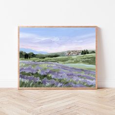 a painting on a wall with a wooden frame in front of it that has a lavender field