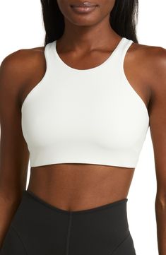 Get into your groove in this ultracomfy sports bra with signature Dri-FIT tech and a breezy back cutout to keep you cool and dry. Racerback Dri-FIT moisture-wicking technology Lined 80% polyester, 20% elastane Machine wash, line dry Imported Versatile Go-dry Sports Bra For Training, White Recycled Polyester Activewear For Gym, White Breathable Activewear Made Of Recycled Polyester, White Breathable Activewear In Recycled Polyester, White Recycled Polyester Activewear For Workout, White Moisture-wicking Sports Bra With 4-way Stretch, White 4-way Stretch Sports Bra With Moisture-wicking, Versatile Racerback Sports Bra For Light Exercise, Versatile White Breathable Activewear