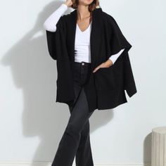 Black One Size Brand New Poncho Black Cape Poncho For Work, Black Workwear Poncho Cape, Black Batwing Sleeve Poncho For Spring, Chic Fall Workwear Cape, Chic Fall Cape For Workwear, Modern Black Outerwear For Layering, Modern Fall Cape For Workwear, Modern Cape For Workwear In Fall, Modern Black Cardigan For Winter