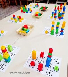 a table with legos and building blocks on it