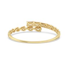 a yellow gold ring with the word love written in small letters, on a white background