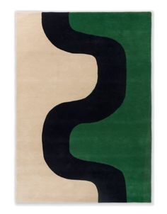 an abstract rug with black, green and white shapes on the bottom right hand side