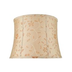 a lamp shade that is on top of a white table cloth with gold and brown designs