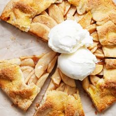 a piece of apple pie with whipped cream on top is cut into squares and sits on a table