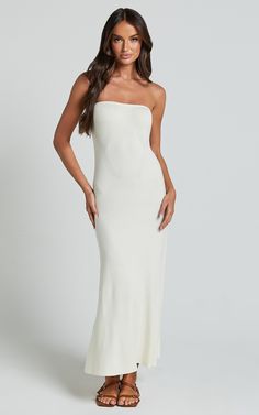 Get ready to turn heads in the Jenara Knitted Midi Dress. This strapless, off-white dress is a must-have for any fashion-forward individual looking to make a statement. The knit design adds a trendy touch, while the midi length keeps it classy and chic. Made from soft viscose fabric, this dress offers both style and comfort. Whether you're heading out for a casual brunch or attending an evening event, the Jenara Knitted Midi Dress is sure to elevate your look and give you that confident boost yo White Strapless Stretch Maxi Dress, Confident Boost, Knitted Midi Dress, Classy Dresses, Off White Dresses, Strapless Neckline, Knit Midi, Knit Midi Dress, Viscose Fabric