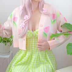 Step into whimsical Spring with our cropped fit jacquard cardigan, adorned with a charming tulip pattern in soft pastel pinks and greens! The comfortable fit ensures ease of wear, whether you're dressing up with a flowing dress or keeping it casual with your favorite jeans. Embrace the soft florals with this versatile piece that effortlessly adds a touch of enchantment to your look! 🌷💚 Details: ♡ 100% Acrylic ♡ Jacquard knit ♡ Model is 5'8" wearing a size Medium. *Please look at the size chart Spring Day Out Cropped Sweater, Spring Cropped Sweater For Day Out, Trendy Green Spring Cardigan, Cute Long Sleeve Spring Cardigan, Spring Fitted Cropped Cardigan, Pink Cropped Cardigan For Spring, Cute Long Sleeve Summer Cardigan, Feminine Pink Cardigan For Spring, Spring Fitted Cardigan With Floral Print