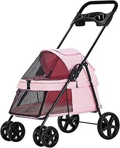 a pink stroller with wheels and a dog in it