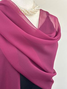 Elevate your style with our exquisite collection of chiffon shawls. Our chiffon shawls are the epitome of elegance and versatility, designed to effortlessly enhance your wardrobe and leave a lasting impression. Made from the fine poly chiffon fabric, these shawls offer a delicate and airy drape that adds a touch of grace to any outfit. Whether you're attending a special occasion, a casual gathering, or simply want to elevate your everyday look, our chiffon shawls are the perfect accessory. Choos Elegant Chiffon Shawl Scarf, Elegant Sheer Chiffon Scarves, Purple Shawl Scarf For Winter, Purple Chiffon Scarf Long, Bohemian Purple Silk Shawl Scarf, Chiffon Shawl, Chiffon Scarf, Sheer Chiffon, Chiffon Fabric