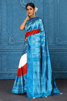 Beautiful cream and turquoise blue Pochampally ikkat silk saree is a perfect drape for parties and festive occasions. It comes with a matching blouse piece. Disclaimer: The shown stitched blouse on the model is for display purpose only. The saree comes with a matching blouse piece and finished with fall and piko. Blue Art Silk Pre-draped Saree With Traditional Patterns, Turquoise Silk Saree With Traditional Drape, Blue Ikat Print Dupatta For Navratri, Blue Ikat Print Dupatta For Diwali, Traditional Turquoise Pre-draped Saree For Festive Occasions, Blue Tussar Silk Pre-draped Saree With Traditional Patterns, Blue Ikat Print Saree For Diwali, Blue Ikat Print Traditional Wear For Navratri, Blue Ikat Print Saree