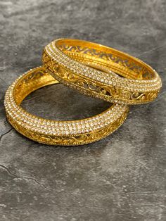 Gold plated bangle set Aruna . Comes in pair.Silver Rhinestone work around . Gold Plated Bangles, Bangle Set, Silver Rhinestone, Gold Bracelet, Gold Plate, Bangles, Plating, Silver, Gold