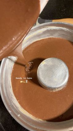 a chocolate sauce being made in a blender