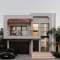 a black car parked in front of a white two story house with stairs leading up to the second floor