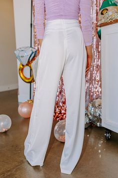 - Perfect for any special occasion, these luxe feeling pants will keep you looking chic! - Lightweight, white colored material - High waistline with boning for structure - Back zip closure - Relaxed pants silhouette that ends in straight floor length hemlines Elegant White Straight Dress Pants, White Stretch Ankle-length Dress Pants, White Ankle-length Pants For Party, White Wide Leg Pants For Summer Night Out, White Ankle-length Pants For Evening, White Wide Leg Formal Bottoms, White Wide Leg Pants For Spring Formal, White Wide Leg Pants For Formal Spring Events, White Straight Leg Pants For Formal Occasions