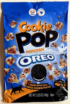 a bag of cookie pop oreo cookies on a white surface with an orange and blue background