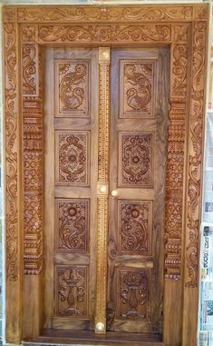 a wooden door with intricate carvings on it