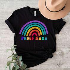 This "Rainbow LGBTQ Proud Mama" shirt is perfect for yourself or to gift to any friend, coworker or family member! It is made of high-quality soft garment and is so comfortable to wear all year round! PRODUCTION TIME: 1-3 business days (Usually 2 days) SHIPPING TIME: 1-5 business days (Usually 3 days)  We do not guarantee delivery times PRODUCT DETAILS: Our Relaxed Fit Tee is a unisex style. 100% soft cotton (fibre content may vary for different colors). Light fabric (4.2 oz/yd² (142 g/m. It's s Pride Parade, Gender Equality, Mama Shirt, Mom Shirt, Long Shirt, Unisex Style, Mom Shirts, Unisex Fashion, Light Fabric