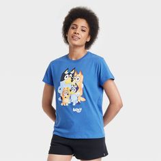 The Women's Bluey Short Sleeve Graphic T-Shirt - Blue makes a great addition to your casual wardrobe. It features fun graphics from the tv show - Bluey, that’s sure to put a smile on your face. Perfect for casual outings or everyday wear, this Women's Bluey Short Sleeve Graphic T-Shirt - Blue is a great pick. Funny Blue T-shirt With Cartoon Print, Fun Blue T-shirt With Character Print, Funny Blue T-shirt With Character Print, Funny Blue Crew Neck Top, Funny Blue Short Sleeve Top, Bluey Shirt, Fun Graphics, School Birthday, Cute Graphic Tees