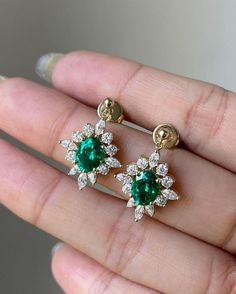 Emerald and Moissanite Flower Earrings - Gold Plated Stud Earrings - Vintage-Inspired Green Gemstone Earrings - Statement Jewelry for Women Add a touch of timeless elegance to your jewelry collection with these Emerald and Diamond Flower Earrings. Crafted with a captivating green emerald at the center, surrounded by sparkling diamond-like stones in a delicate flower pattern, these earrings exude vintage-inspired charm. The emerald is known for its rich, vibrant hue, symbolizing renewal and prosp Emerald Diamond Earrings Studs, Elegant Green Round Flower Earrings, Green Prong-set Dangle Earrings, Green Teardrop Earrings With Prong Setting, Flower Earrings Gold, Emerald Earrings Studs, 9th Grade, Green Jewelry, Emerald Earrings