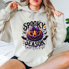 Cute Spooky Season Holloween Hoodie,Gift for Womens,Spooky Pumpkins Hoodie,Cute Witchy Bats Hoodie,Fall Vibes Hoodie, Boho Halloween Hoodie  This hoodie is suitable for children under 14 years old. The drawstrings are closed to prevent the risk of strangulation Hi! Welcome to the 💍 Lord Of The Shirt 💍 store.  We offer a wide range of unique designs tailored specifically for you. Please take a look at the other products in my shop! Our hoodies are made of a thick cotton and polyester blend that provides both comfort and style. There are no side seams and the air-jet yarn ensures a softer feel and less pilling. Plus, our hoodies have double needle stitching on the shoulders, armhole, neck, waistband and cuffs. If you prefer a comfortable fit, we recommend increasing the size by one. If you Spooky Hooded Sweatshirt For Winter, Spooky Hooded Sweatshirt For Fall, Halloween Hooded Spooky Sweatshirt, Spooky Hooded Halloween Sweatshirt, Halloween Hoodie With Drawstring Hood, Hooded Spooky Halloween Sweatshirt, Spooky Long Sleeve Halloween Hoodie, Hooded Halloween Hoodie With Drawstring, Hooded Hoodie With Drawstring For Halloween