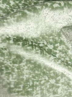 an aerial view of green and white water