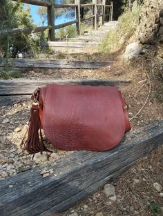 Cognac leather crossbody bag, This bag is a medium size classic crossbody bag. This bag is unlined.  The bag is closed by a magnetic button. This bag you can take every where in any occasion Features : - Cognac leather, - Brass finishing, - Unlined. Size :  - Width 10.2 inch, - Height 8.2 inch, - Adjustable shoulder belt length max 45 inch. If you want to add a boho touch to your bag, buy a suede tassel separately use this link  https://www.etsy.com/it/listing/1524528378/nappina-portachiavi-in-p Everyday Saddle Bag With Magnetic Closure, Leather Saddle Bag With Magnetic Closure For Travel, Everyday Saddle Satchel With Magnetic Closure, Daily Use Crossbody Saddle Bag With Magnetic Closure, Cognac Soft Leather Satchel Saddle Bag, Cognac Soft Leather Saddle Bag Satchel, Cognac Soft Leather Crossbody Satchel, Daily Use Saddle Bag With Magnetic Closure, Brown Saddle Bag With Magnetic Closure For Daily Use