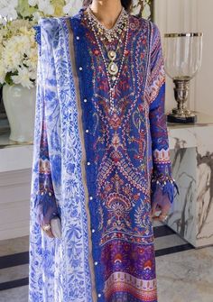 A multi-color Mughal Resham with an exquisite flower pattern on a French blue base and a delicately embroidered side kali. This style comes with a pair of pants and a beautiful ethnic chintz digitally printed dupatta in monotones of French blue. A great statement piece that will keep you looking stylish throughout the season. Shirt Front Center Panel Dyed & Embroidered on Lawn Shirt Side Kali Dyed & Embroidered on Lawn (Right) Shirt Side Kali Dyed & Embroidered on Lawn (Left) Back Plain Dyed on Elegant Purple Printed Lawn Suit, Spring Festive Dress With Digital Print, Blue Bohemian Unstitched Dress, Elegant Formal Dress With Digital Print, Elegant Unstitched Purple Dress, Blue Digital Print Dress For Wedding, Long Sleeve Digital Print Dresses For Party, Long Sleeve Dresses With Digital Print For Party, Blue Wedding Dress With Digital Print