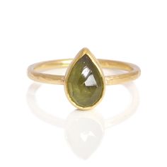 Wow! This moss green pear shaped sapphire is set against warm yellow gold. This unique ring has a vintage feel and would make a fantastic alternative engagement ring. Yellow Gold Teardrop Jewelry With Bezel Setting, Yellow Gold Teardrop Gemstone, Green Teardrop 14k Gold Ring, Minimalist Teardrop Rose Cut Diamond Jewelry, Green 14k Gold Jewelry With Rose Cut Diamonds, Green Sapphire Ring, Green Rose, Green Sapphire, Alternative Engagement Rings