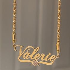 crafted from 18K Gold Plated Stainless Steel for a gleam so bright, you'll be saying "who dat!?". Tarnish resistant and hypoallergenic, this extra special nameplate is graced with an iced out heart consisting of AAA CZ stones for a touch of extra sparkle. Get your name in lights (or at least in shimmery stones!) today! 18k Gold Plated Stainless Steel Tarnish Resistant Nickel and Lead Free Hypoallergenic ******To avoid stones from falling and to maintain the longevity of the necklace we suggest t Cheap Birthstone Name Necklace For Birthday, Luxury Personalized Gold Charm Necklace, Luxury Nameplate Necklace For Anniversary, Gold Name Necklaces, Luxury Personalized Charm Necklaces As Gift, Luxury Nameplate Necklace As A Gift, Luxury Silver Heart Anniversary Necklace, Luxury Nameplate Name Necklace For Gift, Cheap Metal Nameplate Jewelry