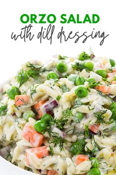 a white bowl filled with pasta and vegetables