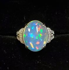 Awesome Natural Rainbow Fire Opal Ring, 11.6x15mm 4.8 Carat Ethiopian Opal,  See Fantastic Fire On Video! 925 Sterling Silver Ring With Cubic Zirconia Trimmed Band, Rhodium Plated, Size 6. Velvet Ring Box. Formal Oval Opal Ring In Sterling Silver, Dazzling Oval Opal Ring For Formal Occasions, Gia Certified Oval Cabochon Jewelry Gift, Velvet Ring Box, Rainbow Fire, Fire Opal Ring, Natural Rainbow, Opal Ring, Opal Rings