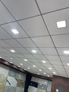 an empty room with several different types of tiles on the walls and ceiling, all lined up in rows