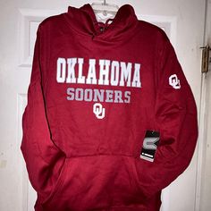 University Of Oklahoma Sooners Marquee Hoodie Smoke Free Closet Size: Xl. Color: Red, White. 100% Polyester. Approximate Measurements While Laying Flat. Armpit To Armpit: 24” Shoulder To Bottom Hem(Length): 28” Sleeves: 24” Oklahoma Sooners And The Ou Logo Are On The Front. An Oklahoma Ou Logo Is Also On The Left Sleeve. (Photos 1,8,9) The Back Is Blank. Hoodie Is Still In The Original Plastic Packaging. If You “Like” The Item, Try Making An Offer. Please Let Me Know If You Have Any Questions. Thanks For Checking Out My Closet! Norman Oklahoma Kansas City Chiefs Texas Rangers Dallas Stars Fc Dallas Dall Red Team Spirit Hoodie, Red Game Day Fan Apparel Hoodie, Sporty Red Hoodie For Game Day, Casual Red Hoodie For Sports Events, Red Team Spirit Hoodie For Streetwear, Collegiate Red Hoodie For Fan Gear, Collegiate Red Hoodie For Sports Season, Red Hoodie With Team Name For Winter, Red Collegiate Hoodie For Fan Gear