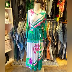 D E S C R I P T I O N Stunning Vintage 1970s Jersey Stretch Short Sleeve Maxi Dress With Floral Print. S I Z E & M E A S U R E M E N T S Measurements Taken Across While Garment Laying Flat And Unstretched. Double Measurement To Get The All Around. Length: 55" Chest: 15" Hips: 17” Waist: 15" Sleeve Length: 21" Shoulders: 15” Fits As Size Small Authenticity Guarantee All Items Sold In Our Shop Are 100% Guaranteed Authentic Vintage Or Your Money Back. Retro Midi Dress For Spring Day Out, Vintage White Flowy Maxi Dress, Retro Multicolor Maxi Dress For Spring, Retro White Maxi Dress For Spring, White Flowy Vintage Maxi Dress, Retro Spring Maxi Dress, Spring Retro Maxi Dress, White Retro Beach Dress, Retro White Beach Dress