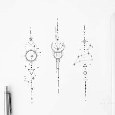 three clocks are hanging on the wall next to a pen and paper clippings