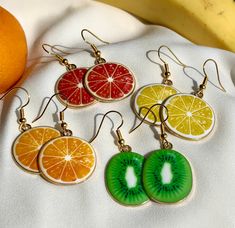 Adorable fruit earrings!  Available in various fruits (kiwis, oranges, lemons and grapefruits), the charms measure around 20mm in diameter. Super affordable and made with love :) Please take a look at the other earrings available on my shop, or follow me on instagram to get regular updates!  @pinkskyearrings Multicolor Fruit Design Earrings For Gift, Yellow Fruit Design Earrings For Gift, Yellow Fruit Design Earrings Gift, Yellow Fruit Design Earrings As Gift, Green Fruit Design Earrings For Gifts, Green Fruit Design Earrings Gift, Green Fruit Design Earrings As Gift, Gift Green Earrings With Fruit Design, Orange Fruit Design Earrings As Gift