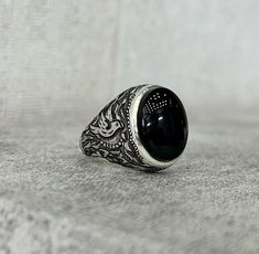 Old Rare Black Stone Ring Yemeni Stone Silver Ring Shia Ring Black Yamani Ring Mens Mothers Day Gift Silver Ring Fine Mens Black Stone Ring * Total Carat: 10 Carat * Total Weight Silver: 20 grams * Ring Sizes: All US, UK International Size Available (5US,6US,7US,8US,9US,10US,11US,12US,13US,14US,15US,16US) * Re-sizable: Yes * Type: Natural Unheated Untreated Gemstone * Shipment Via FedEx Note: Stone Color as seen on the Store We take the photos mostly in a Natural Daylight Night Light condition a Formal Black Dome Ring With Polished Finish, Black Oval Rings For Promise, Oval Black Rings For Promise, Black Oval Promise Ring, Oval Black Promise Ring, Black Engraved Ring With Polished Finish For Formal Occasions, Formal Black Engraved Ring With Polished Finish, Elegant Black Oval Dome Ring, Black Dome Ring With Polished Finish As Gift