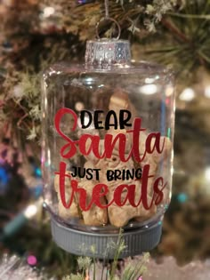 a glass ornament that says dear santa just bring treats