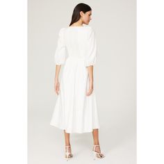 White cotton blend (96% Organic Cotton, 4% Spandex). A-line. 3/4 sleeves. Sweetheart. Imported. Chic Spring Midi Dress With Half Sleeve, Chic Midi Dress With Half Sleeves For Spring, Elegant Cotton Fit And Flare Midi Dress, Chic A-line Puff Sleeve Dress For Daywear, Spring Cotton Midi Dress Fit And Flare, Spring Cotton Midi Dress With Fit And Flare, White Cotton Puff Sleeve Fitted Dress, White Fitted Puff Sleeve Cotton Dress, White Cotton Midi Dress For Formal Occasions