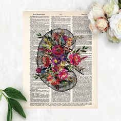 a flower arrangement on an old book page