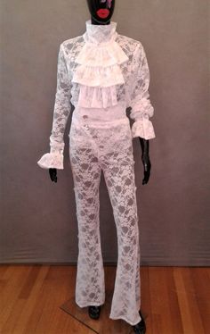 "This costume is completely handmade. The costume consists of a all white stretch lace top with ruffles and rhinestone buttons at the cuff The pants are high waist with center back invisible zipper with rhinestone buttons and rhinestone buttons down the side of the pants The pants are fitted with a flare at the bottom hem Made to order sizes: XS - 32-33\" bust, 24-25\" waist, 33-34\" hips S - 34-35\" bust, 26-27 waist, 35-36\" hips M - 36-37\" bust, 28-29 waist, 37-38\" hips L - 38-39\" bust, 30 Fitted Ruffled Bottoms For Costume Party, Fitted Ruffled Bottoms For Costume, Fitted White Pants With Lace Trim, Fitted Party Set With Lace Trim, White Long Sleeve Costume Party Set, White Long Sleeve Sets For Costume Party, White Lace Party Bottoms, Fitted White Lace Pants, Fitted White Costume Sets