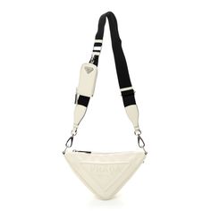 This is an authentic PRADA Grace Lux Triangle Shoulder Bag in White. This stylish bag is crafted of white calfskin leather and is decorated with an embossed Prada logo. The bag features a black nylon shoulder strap and a top zipper that opens to a black logo-jacquard interior. Prada Nylon, Prada Logo, Prada Saffiano, Zip Tote, Mini Tote Bag, Mini Tote, Black Nylon, Stylish Bag, Black Logo