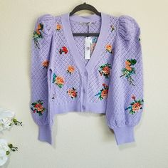 Nwt, Size Medium. Alice + Olivia's Morita Cardigan Features A Cropped Silhouette With Voluminous Puff Sleeves. This Pointelle Style Is Embellished With Bright, Embroidered Floral Patches. V-Neck Long Puff Sleeves Button-Front Closure 98% Cotton/2% Elastane Dry Clean Only Imported #Gryrk Fitted Cardigan For Brunch, Chic Purple Cardigan For Spring, Chic Fitted Cardigan With Puff Sleeves, Casual Puff Sleeve Cardigan For Spring, Fitted Cardigan For Brunch In Fall, Purple Fitted Cardigan For Spring, Spring Fitted Purple Cardigan, Fitted Purple Cardigan For Spring, Spring Sunrise