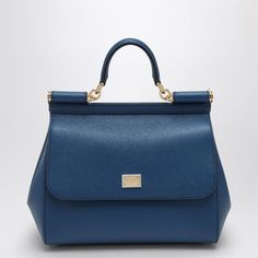 Large Royal Blue Grained Leather Handbag From Dolce & Gabbana Featuring A Front Flap, A Concealed Snap Closure, A Top Handle, An Adjustable And Removable Shoulder Strap, A Logo Plaque, An Internal Zip Pocket With Logo, A Mobile Phone Pocket And Metal Feet. Width 25 Cm X Height 22 Cm X Depth 12 Cm Adjustable Shoulder Strap Length Min 103 Cm - Max 120 Cm Handle Drop: 8 Cm Size Type: Int Material: Leather Sku: 2f-Bb6002a1001/O_dolce-87398_100 Welcome To The Official Luosophy Poshmark Closet! Luosop Navy Blue Bag, Dolce And Gabbana Handbags, Black Balenciaga, Leopard Print Fabric, Blue Handbags, Woman Bags Handbags, Logo A, Dolce E Gabbana, Sicily